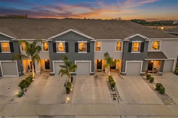 a view of multiple houses with a yard