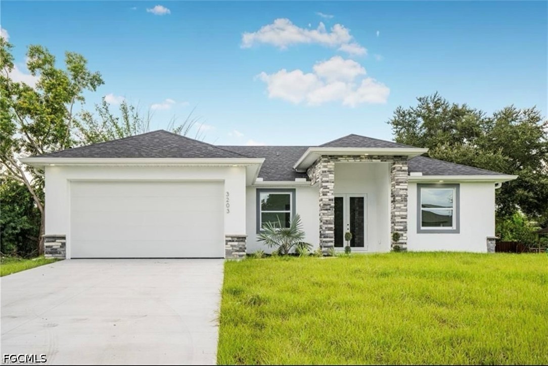 3203 24th Street Southwest Lehigh Acres, FL 33976 - Photo 1 of 19 a front view of house with yard and trees in the background