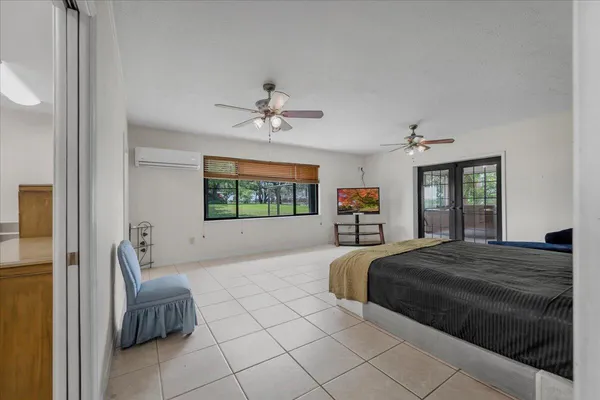 a utility room with cabinets washer and dryer