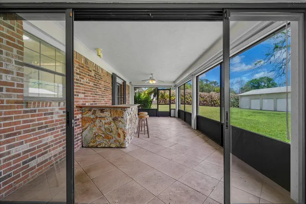 a view of a house with a yard and tree s
