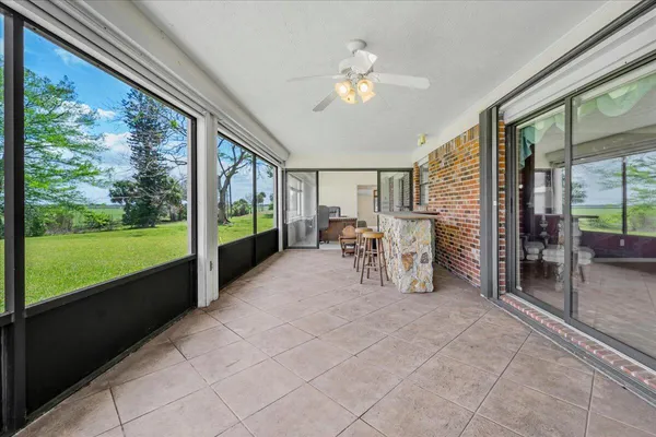 a view of an chairs and table in the patio