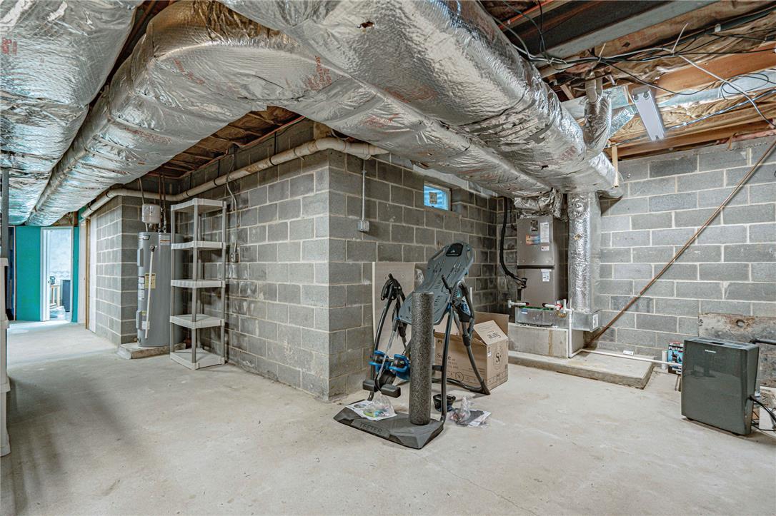 652 Old State Road Oley, PA 19547 - Photo 37 of 54 Concrete block walls and sturdy concrete flooring define this utilitarian basement space.