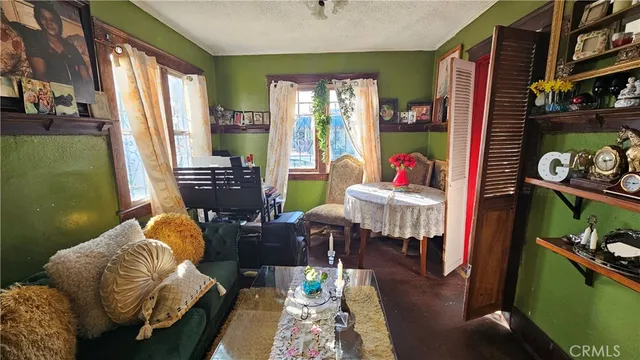 a living room with furniture and a table