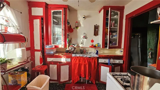 a kitchen with blue cabinets and a stove