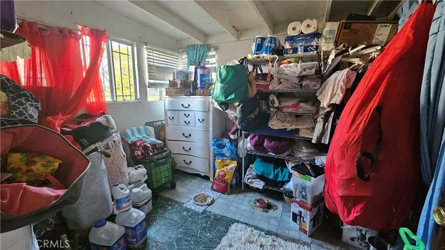 a bathroom with a toilet sink vanity granite and tub