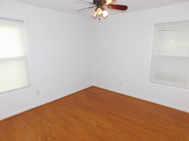 1710 Pine Road Marietta, GA 30062 - Photo 18 of 23 an empty room with a chandelier fan