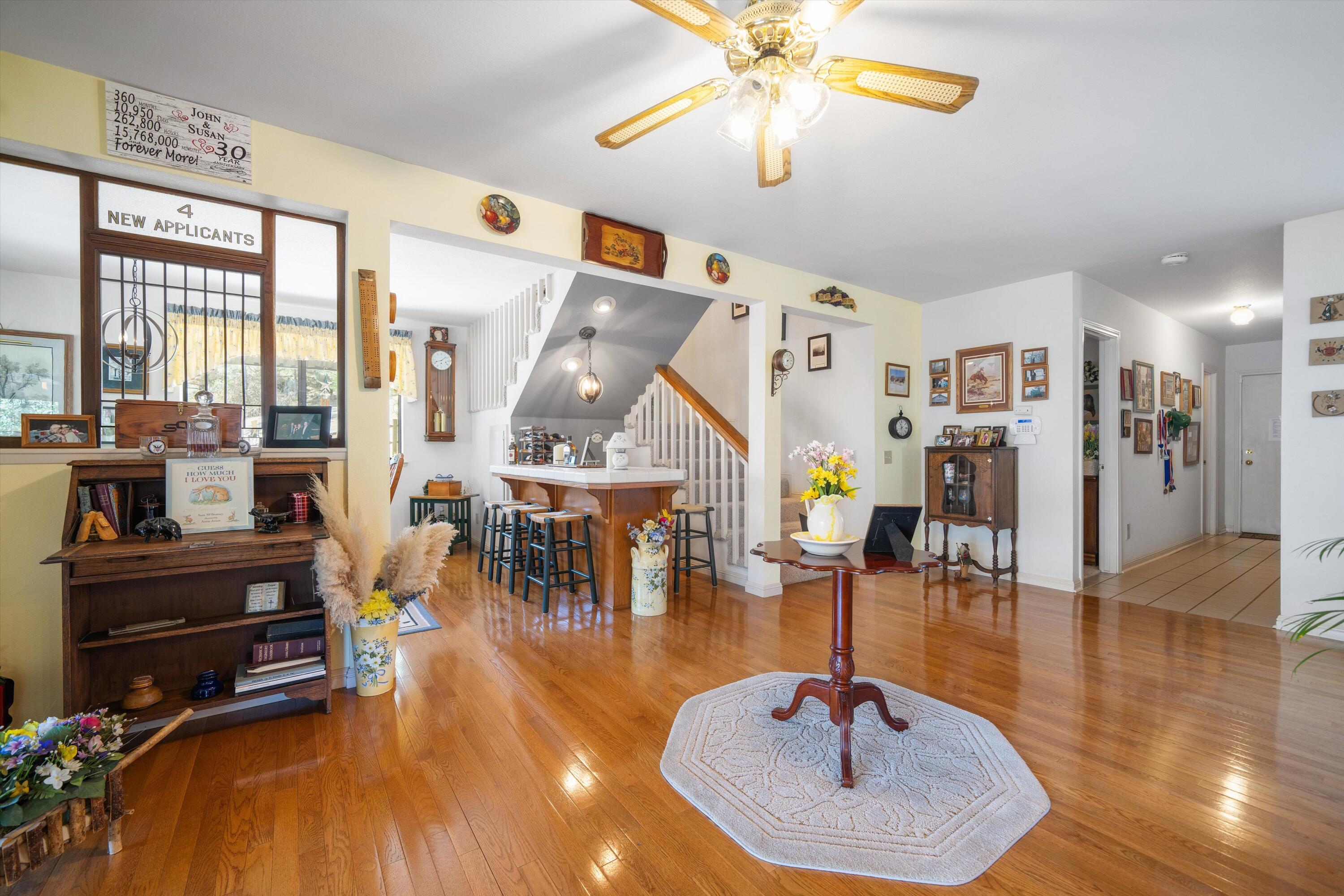 26460 Brian Place Tehachapi, CA 93561 - Photo 13 of 50 a living room with furniture and a chandelier