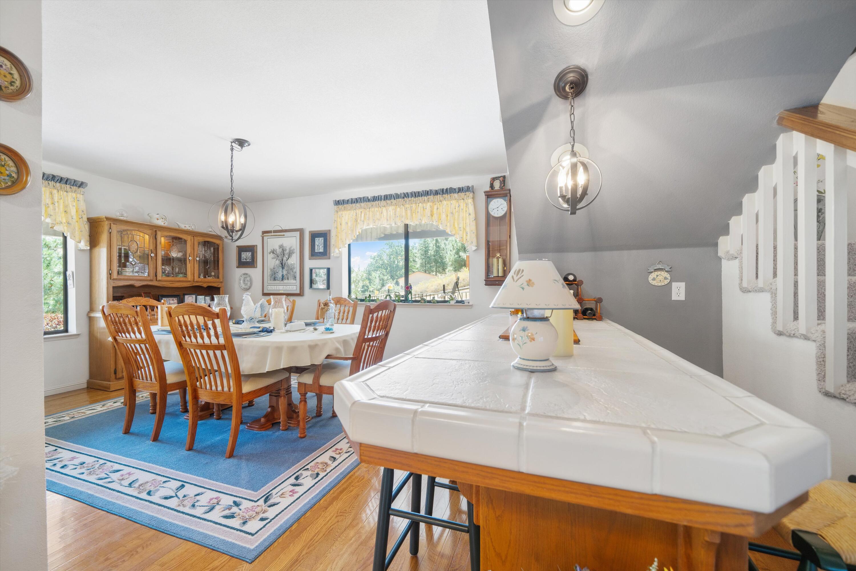 26460 Brian Place Tehachapi, CA 93561 - Photo 14 of 50 a living room with furniture a chandelier and a table