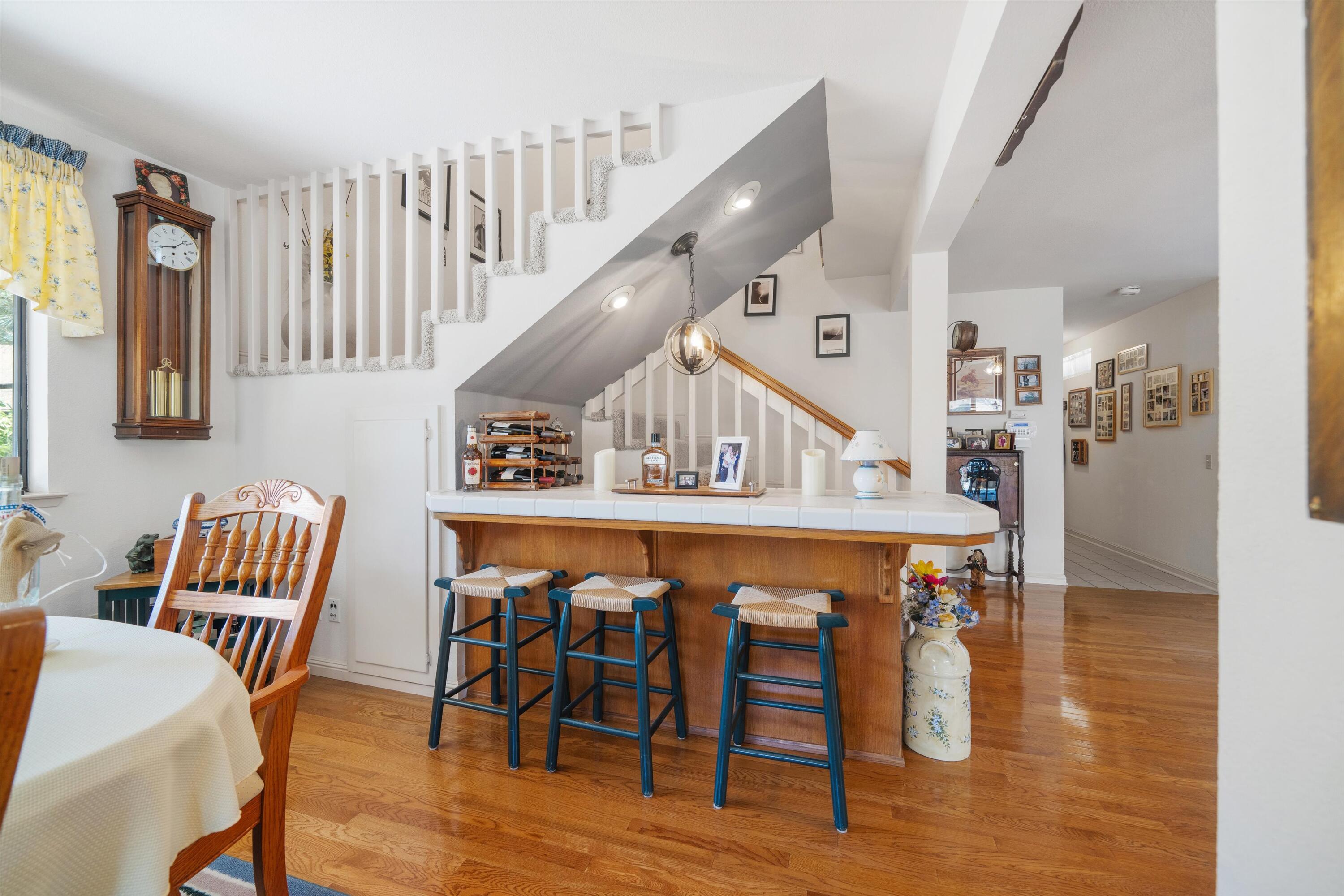 26460 Brian Place Tehachapi, CA 93561 - Photo 16 of 50 a dining room with furniture and wooden floor