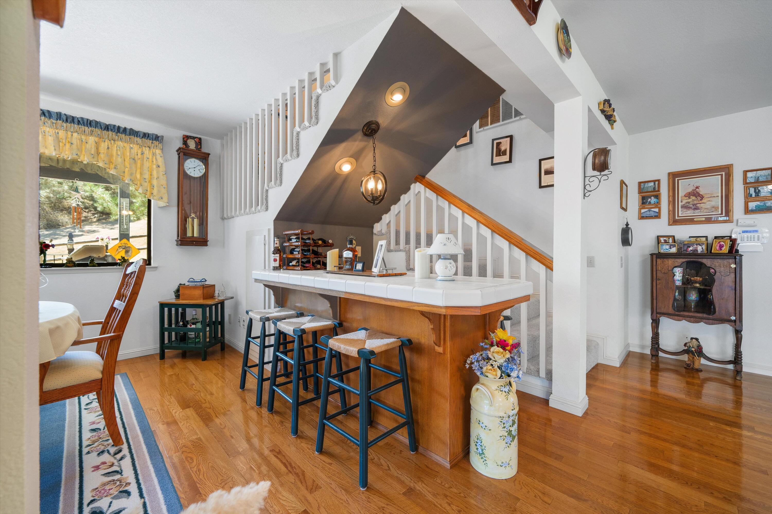 26460 Brian Place Tehachapi, CA 93561 - Photo 17 of 50 a view of a dining room with furniture window and wooden floor