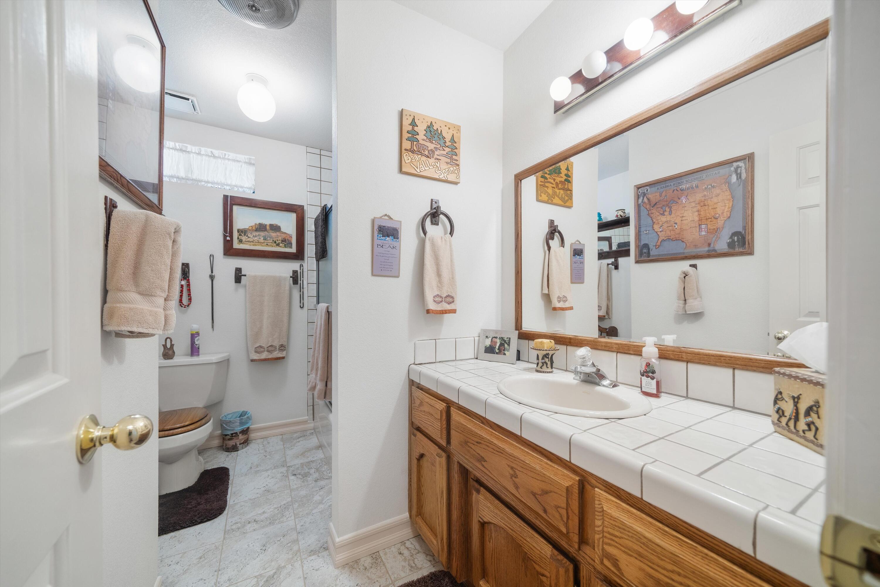 26460 Brian Place Tehachapi, CA 93561 - Photo 20 of 50 a bathroom with a sink double vanity