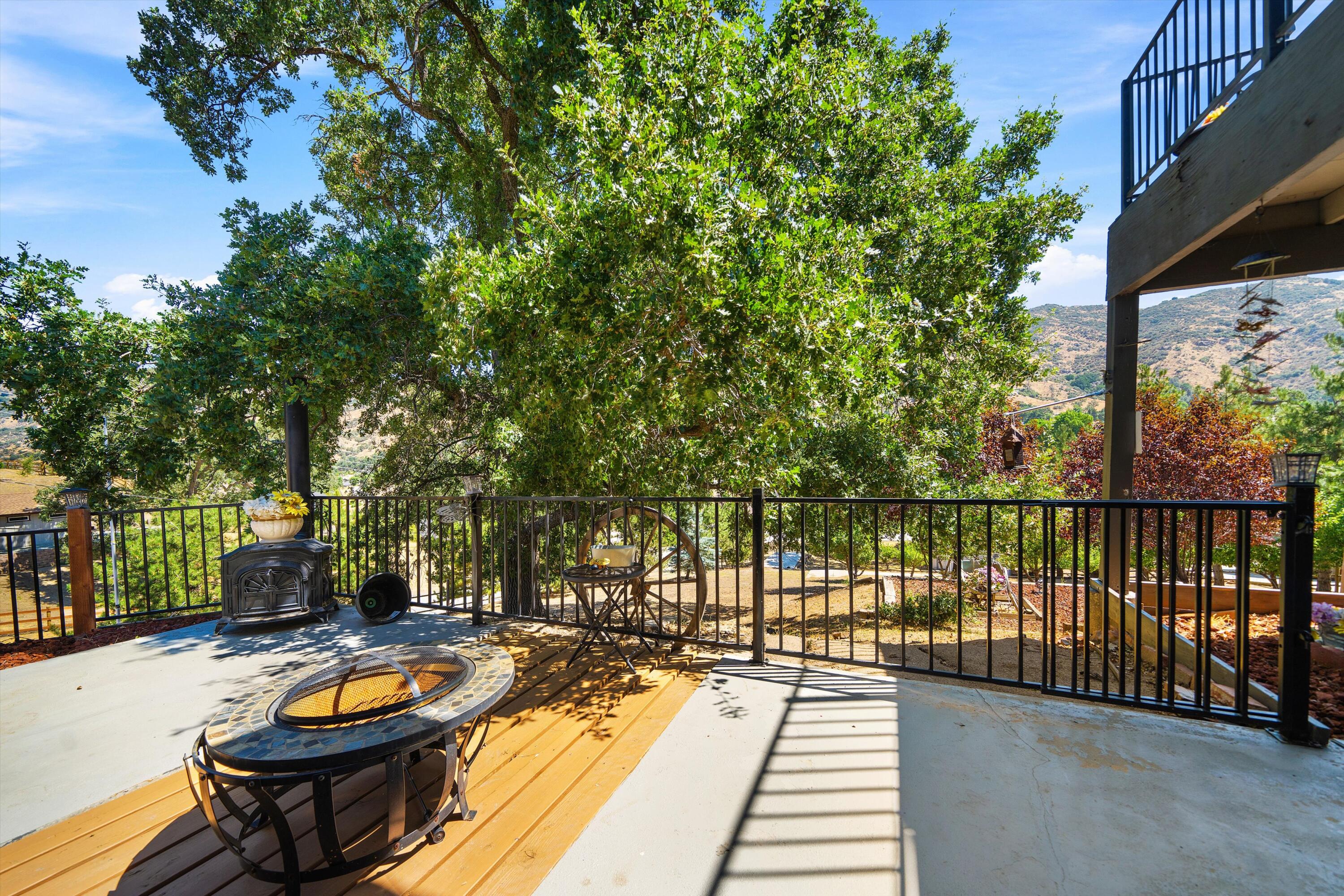 26460 Brian Place Tehachapi, CA 93561 - Photo 35 of 50 a view of a balcony with two chairs and a table