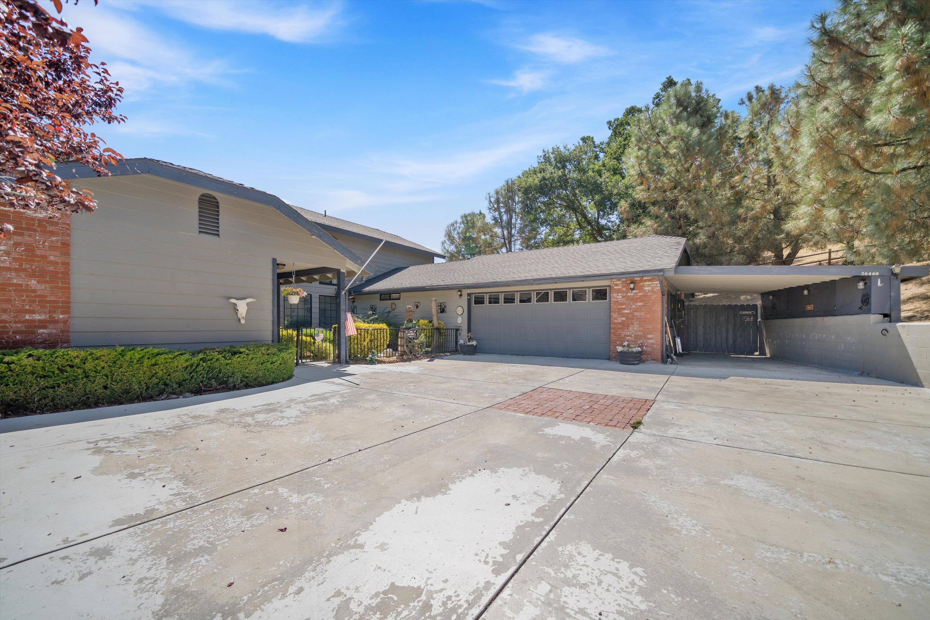 26460 Brian Place Tehachapi, CA 93561 - Photo 36 of 50 a view of a house with a yard and potted plants