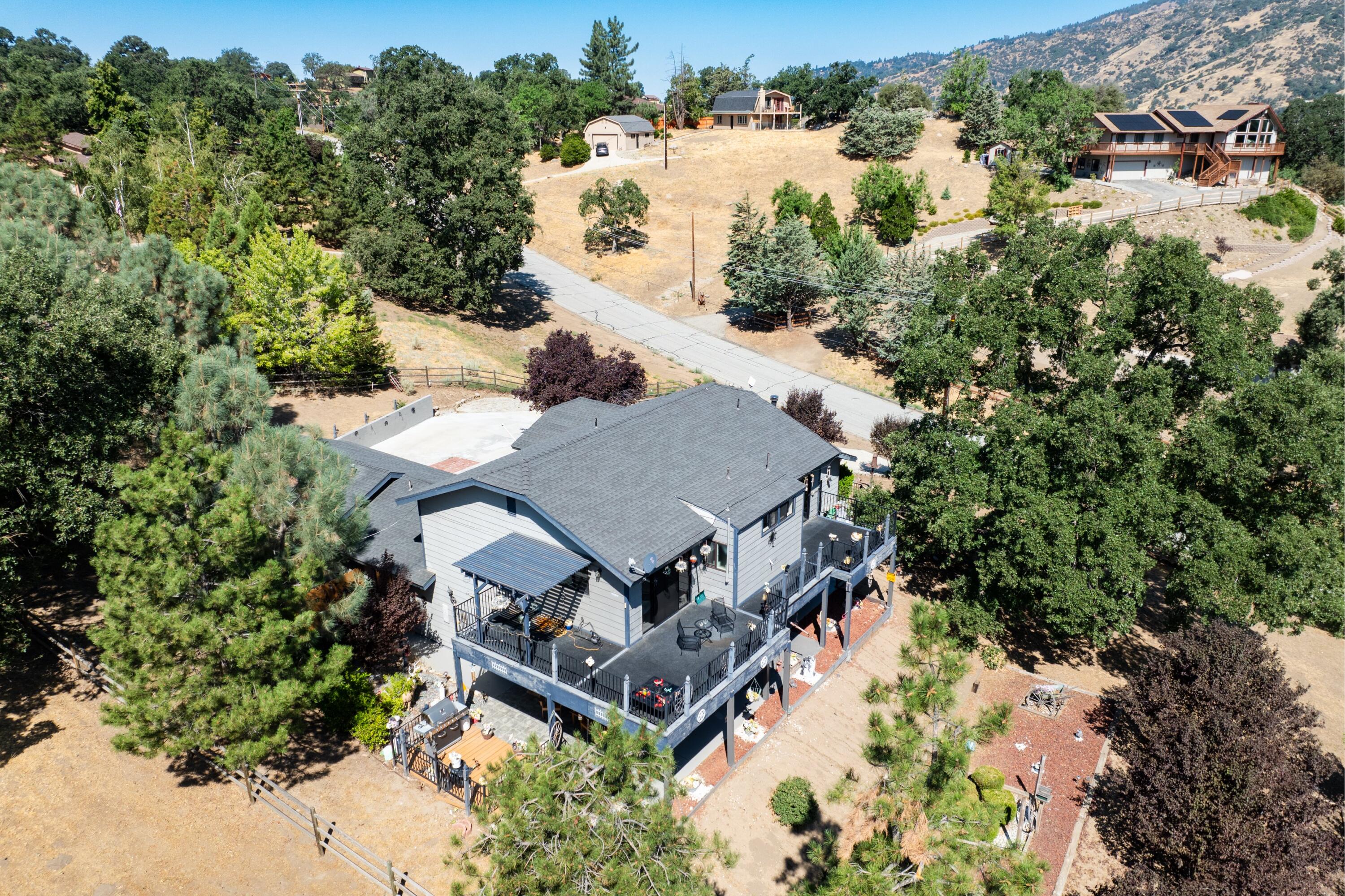 26460 Brian Place Tehachapi, CA 93561 - Photo 38 of 50 an aerial view of a house with a yard