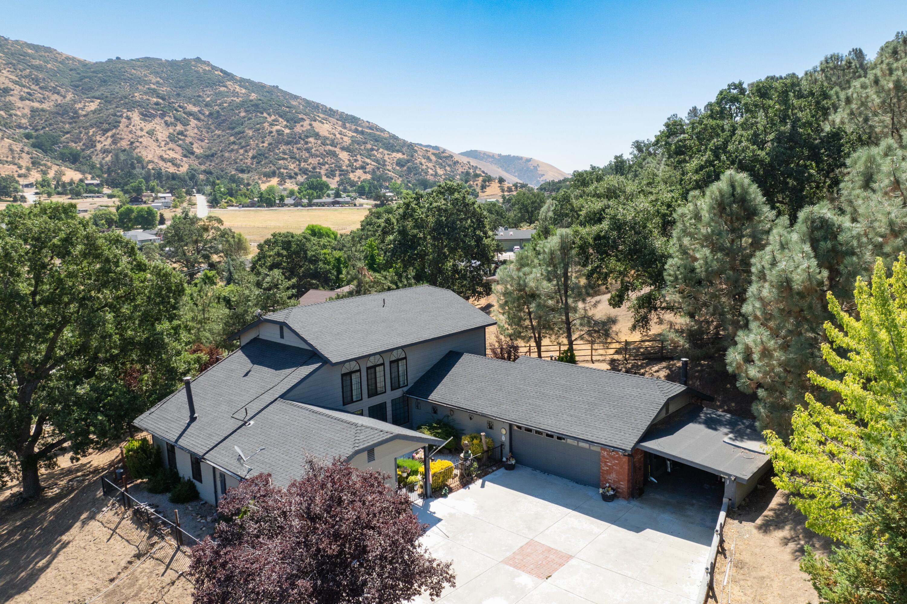 26460 Brian Place Tehachapi, CA 93561 - Photo 39 of 50 an aerial view of a house with a yard and mountain view in back