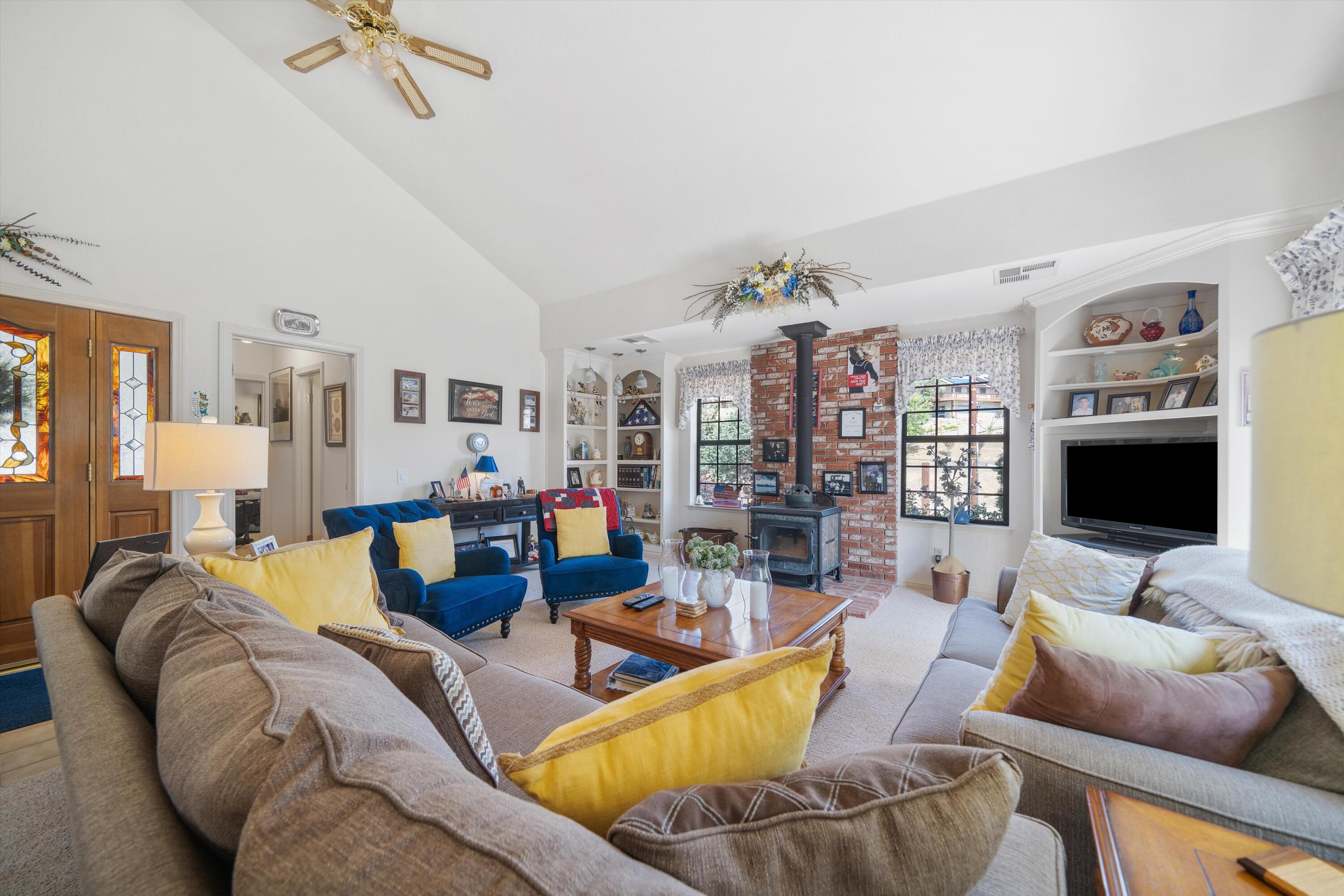 26460 Brian Place Tehachapi, CA 93561 - Photo 4 of 50 a living room with furniture and a flat screen tv