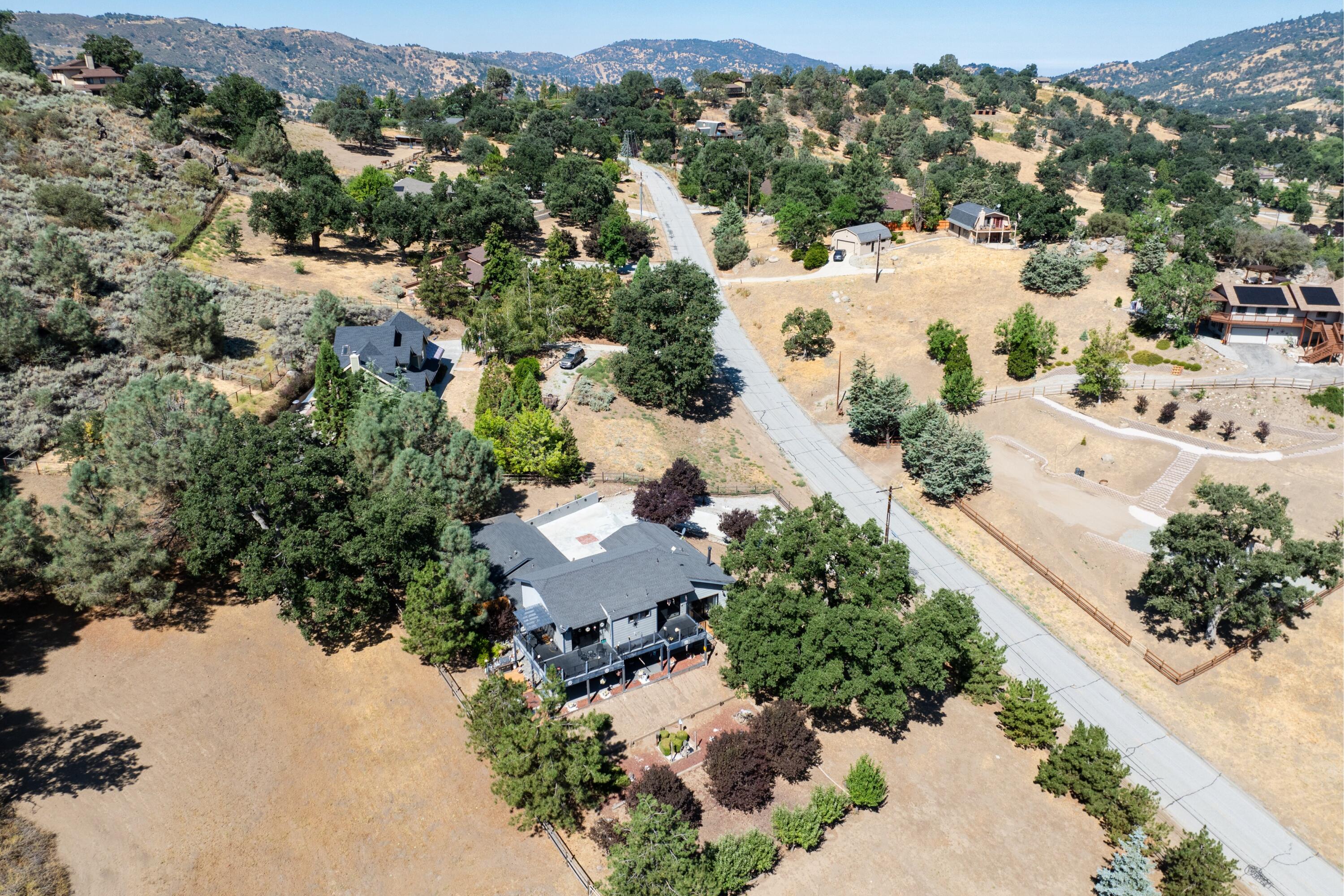 26460 Brian Place Tehachapi, CA 93561 - Photo 42 of 50 an aerial view of residential houses with outdoor space