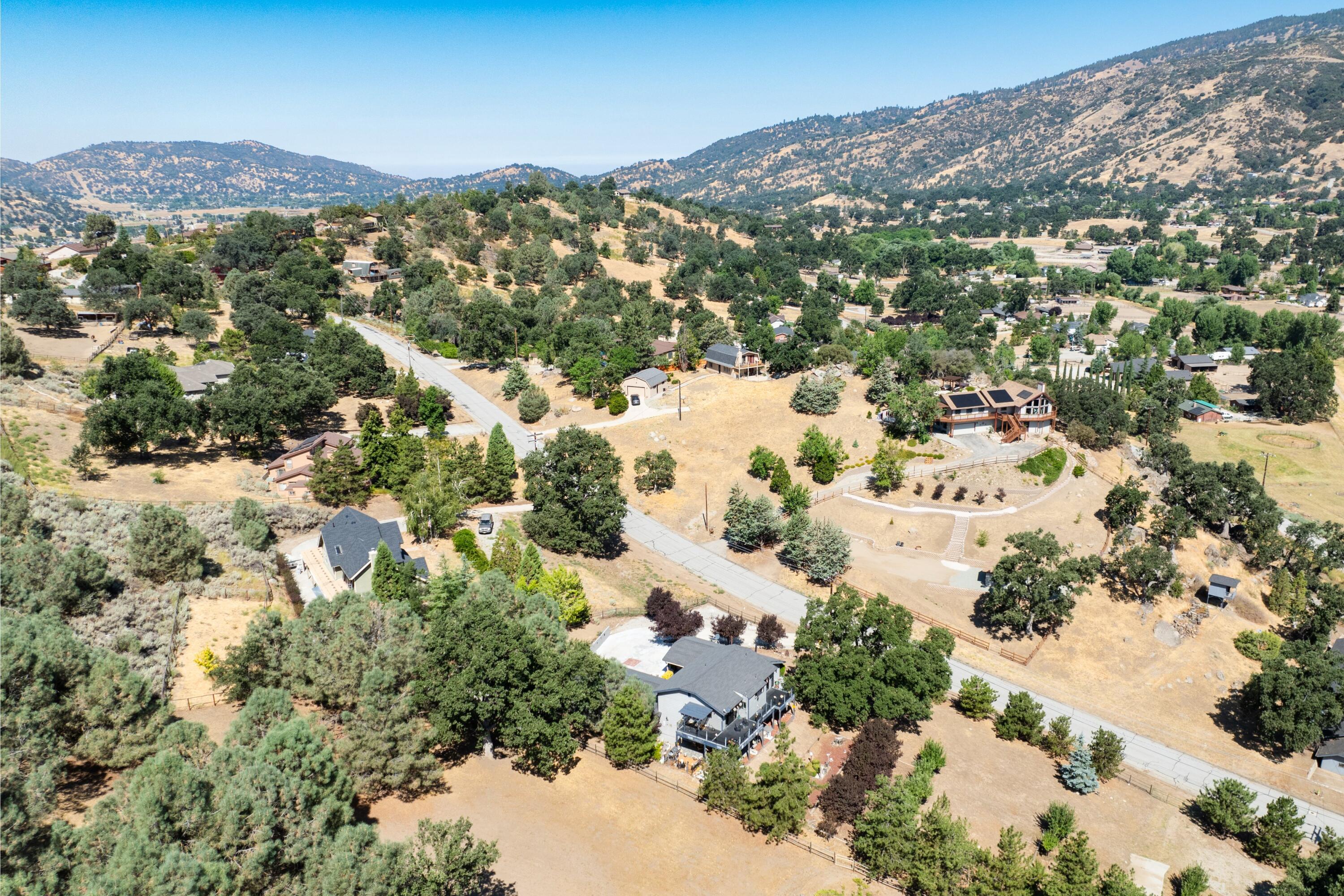 26460 Brian Place Tehachapi, CA 93561 - Photo 44 of 50 a view of a city with mountains in the background