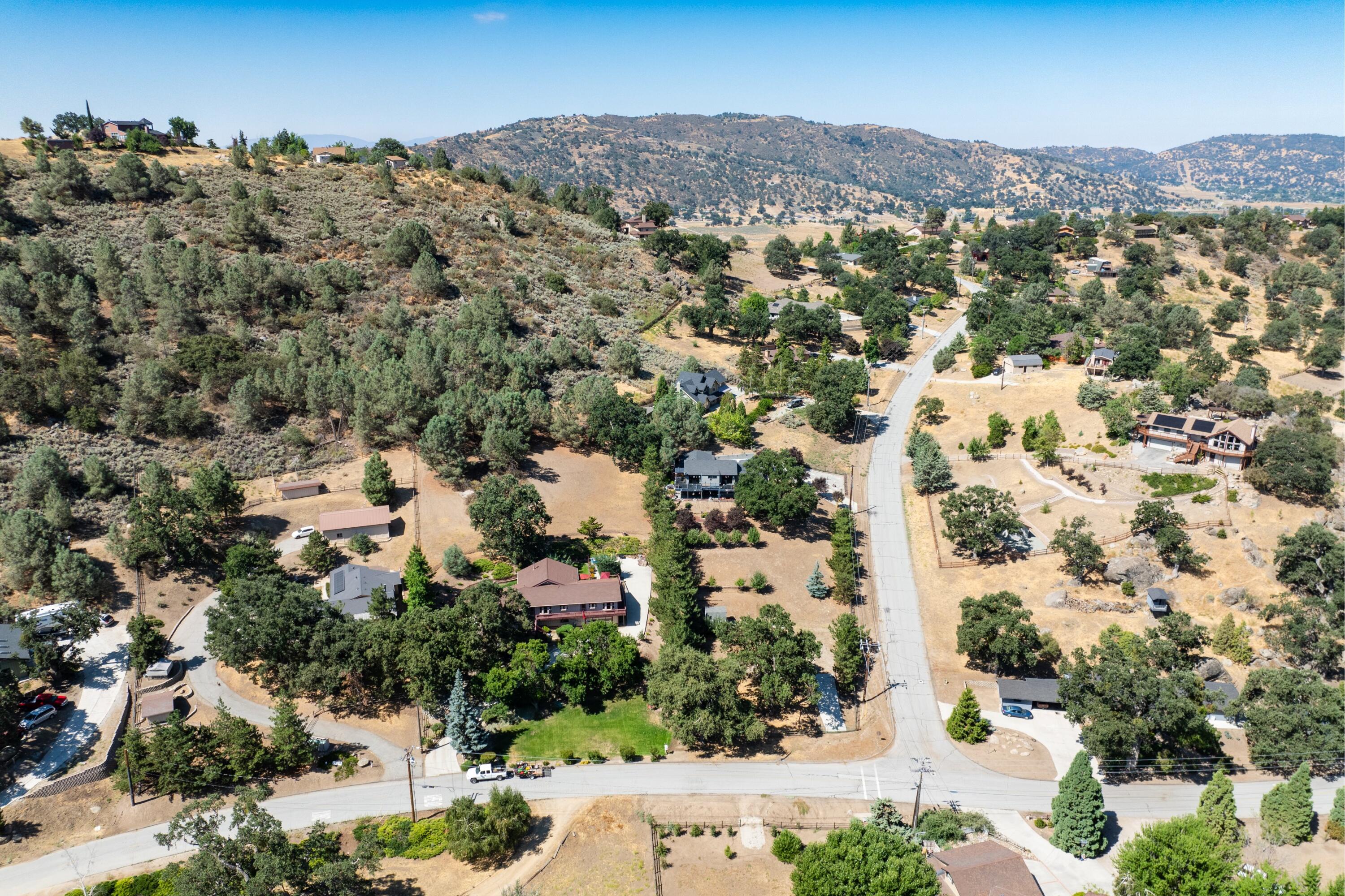 26460 Brian Place Tehachapi, CA 93561 - Photo 45 of 50 an aerial view of residential houses with outdoor space and trees