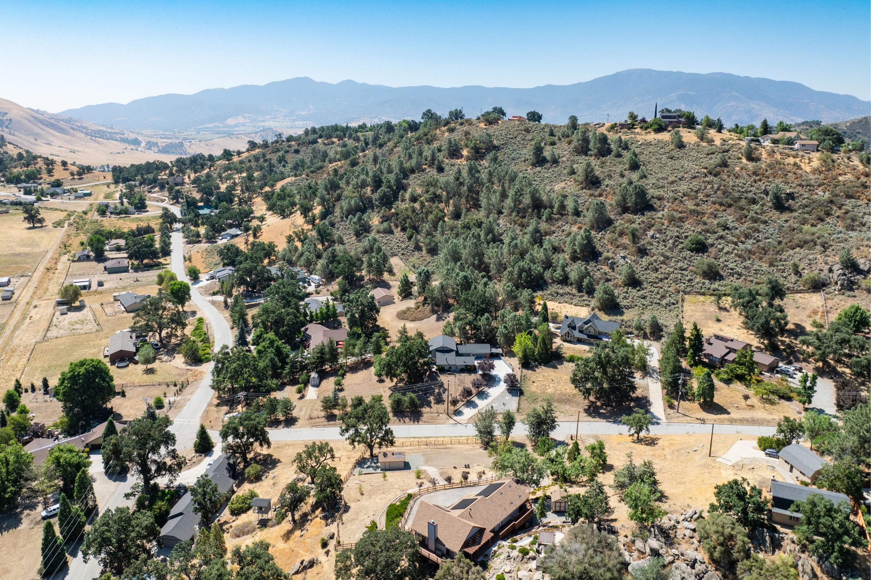 26460 Brian Place Tehachapi, CA 93561 - Photo 46 of 50 an aerial view of residential houses with outdoor space and trees