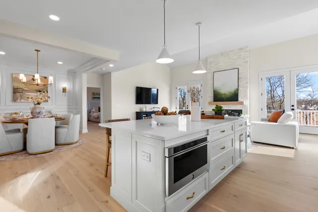 a kitchen with stainless steel appliances kitchen island a large counter and a sink