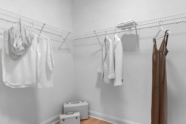 a bathroom with a double vanity sink mirror and shower