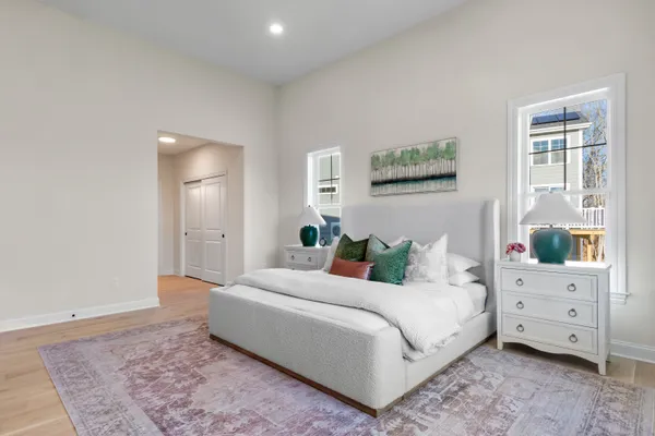 a living room with furniture and view of kitchen