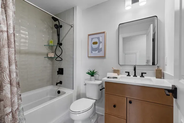 a spacious bedroom with a bed and a window