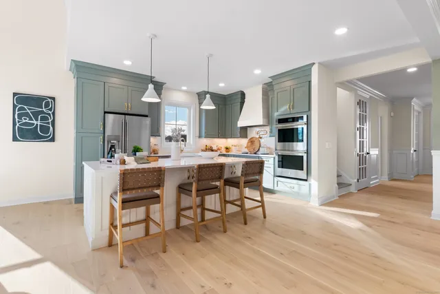 a kitchen with cabinets a sink and appliances