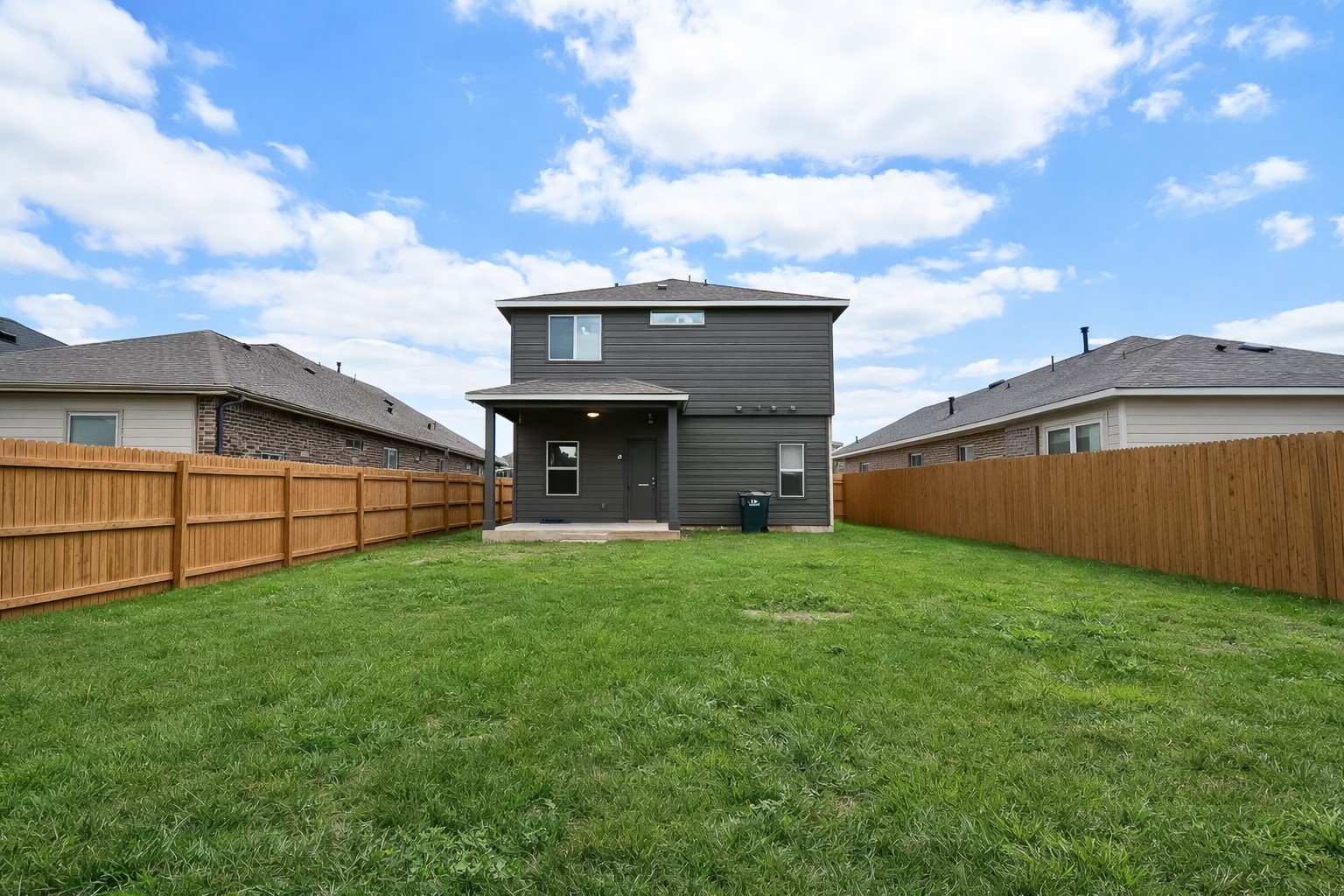 940 Paddock Lane Georgetown, TX 78626 - Photo 5 of 32 Expansive grass yard featuring a wooden privacy fence