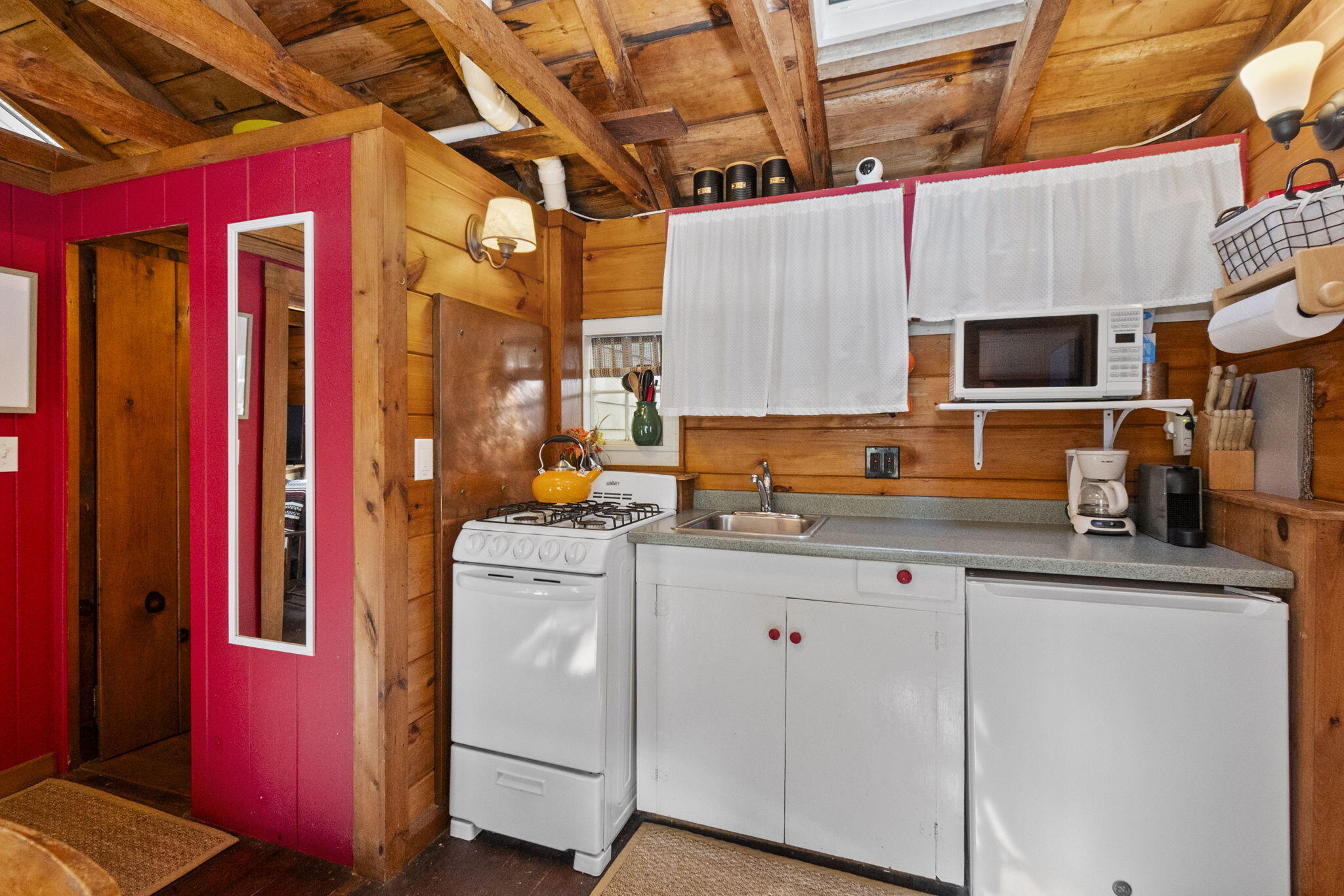 1975 State Highway, Unit 5 Eastham, MA 02642 - Photo 13 of 28 a kitchen with a sink stove and cabinets