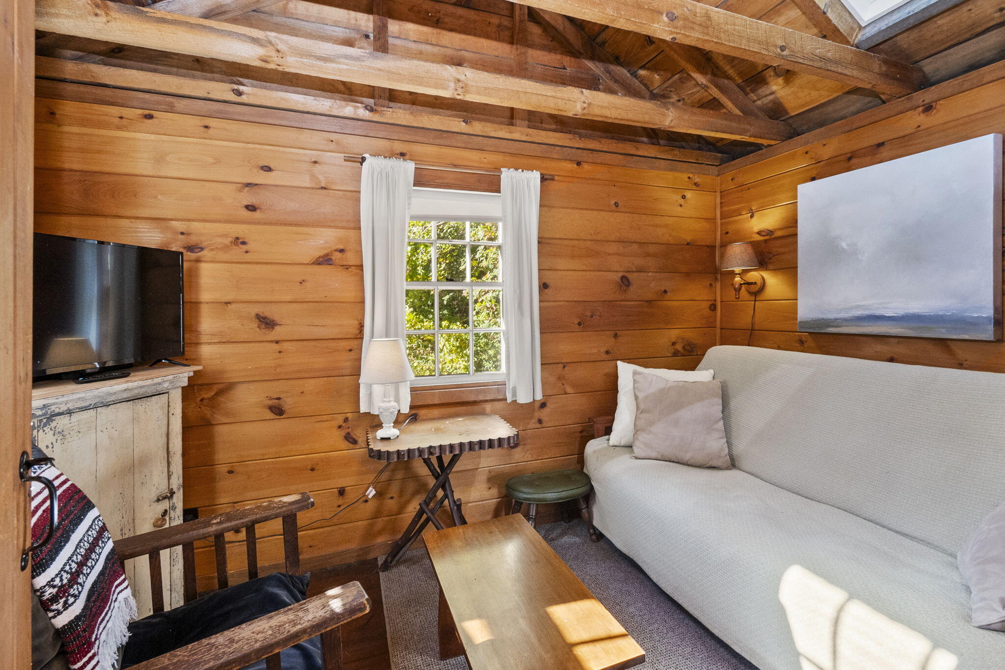 1975 State Highway, Unit 5 Eastham, MA 02642 - Photo 14 of 28 a living room with furniture and a flat screen tv