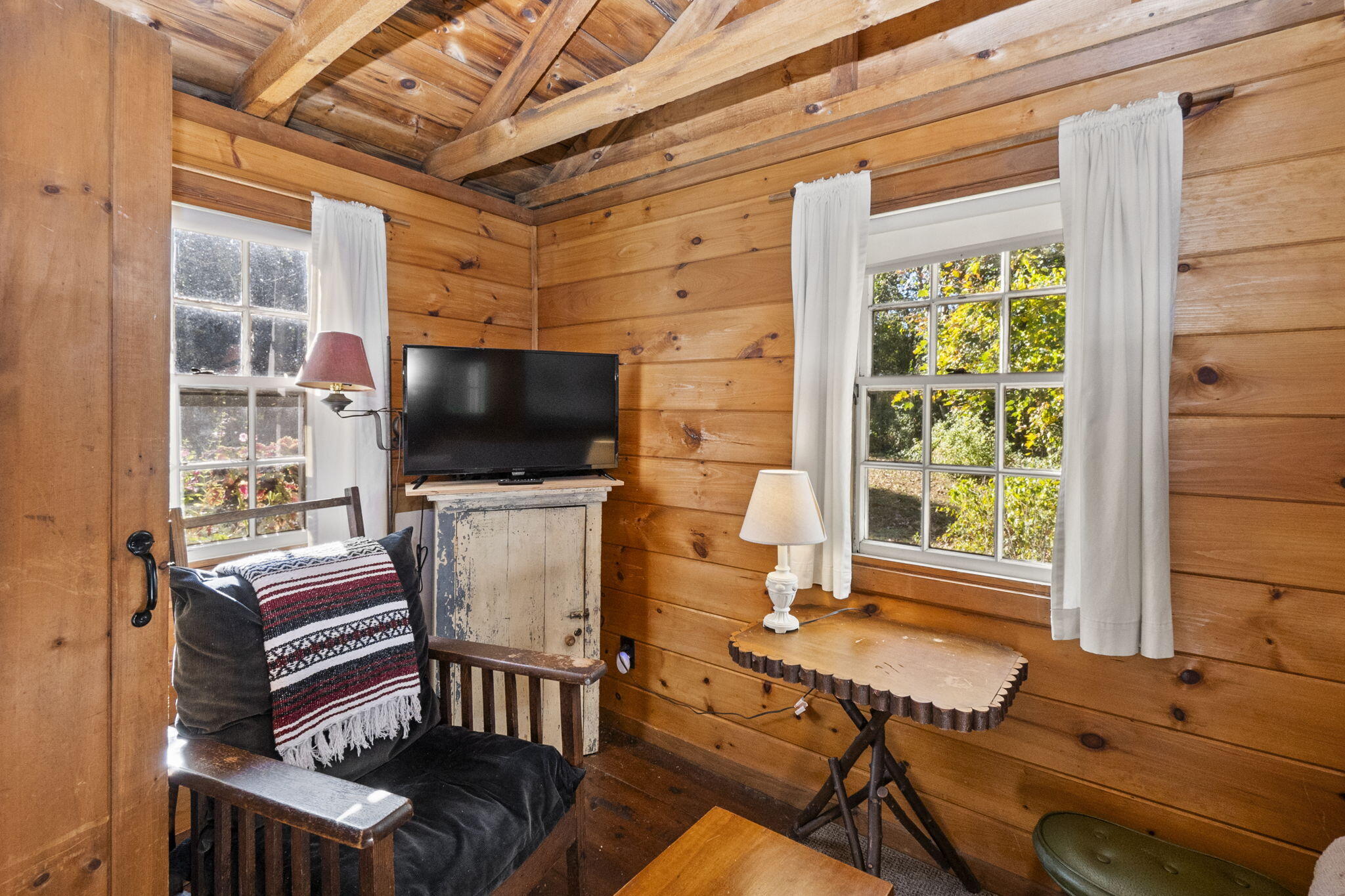 1975 State Highway, Unit 5 Eastham, MA 02642 - Photo 15 of 28 a living room with furniture and a flat screen tv