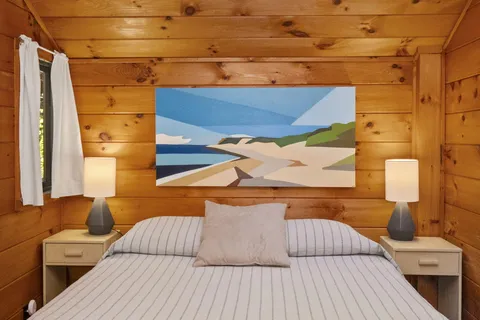 a view of balcony with a couch and wooden floor