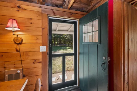 a bathroom with a shower and a window