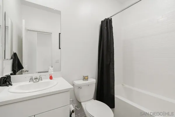 a bathroom with a sink toilet and a bathtub