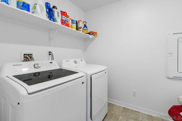 a utility room with dryer and washer