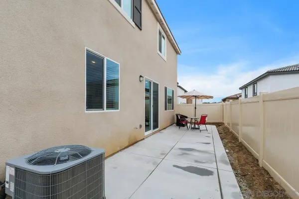 a backyard of a house with seating space