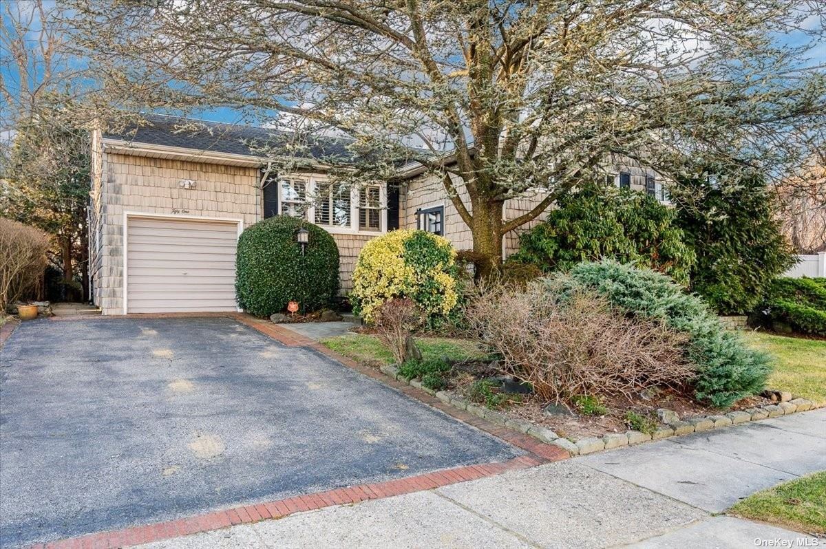 51 Heatherfield Road Valley Stream, NY 11581 - Photo 1 of 1 a view of a front of a house with a yard