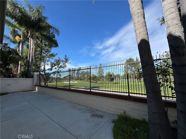 a view of a fence in front of a house