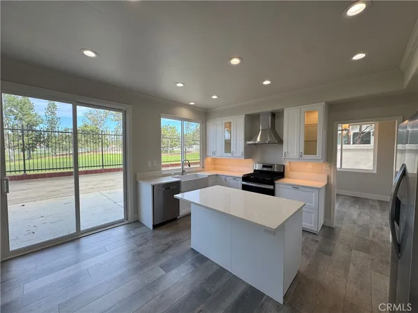 a kitchen with counter top space and stainless steel appliances