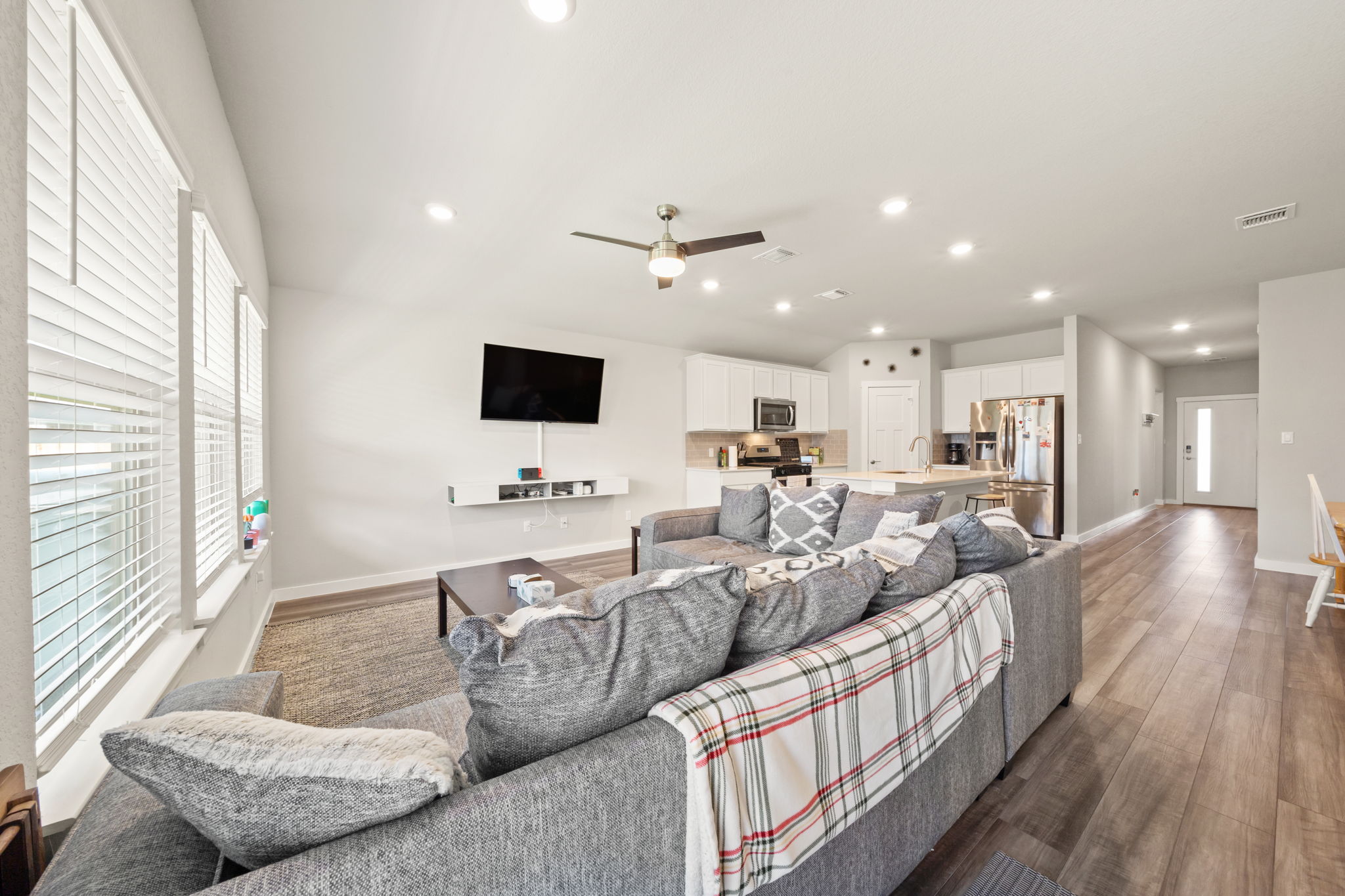 1117 Tipton Street Georgetown, TX 78633 - Photo 15 of 40 Open-concept living area featuring wood-finish flooring and recessed lighting