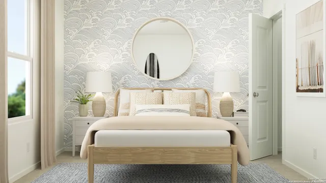 a bedroom with a bed and a mirror