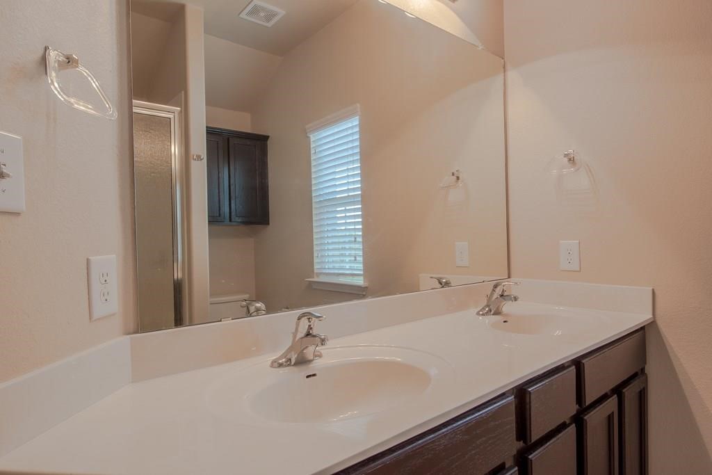 636 Lookout Tree Lane Round Rock, TX 78664 - Photo 13 of 23 a bathroom with a sink and a mirror