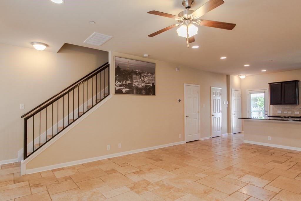 636 Lookout Tree Lane Round Rock, TX 78664 - Photo 4 of 23 a view of a livingroom with kitchen and furniture