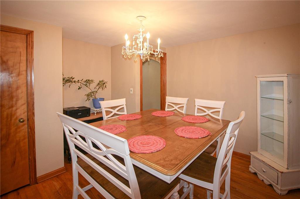 164 Gill Hall Road Clairton, PA 15025 - Photo 9 of 30 a dining room with a table and chairs