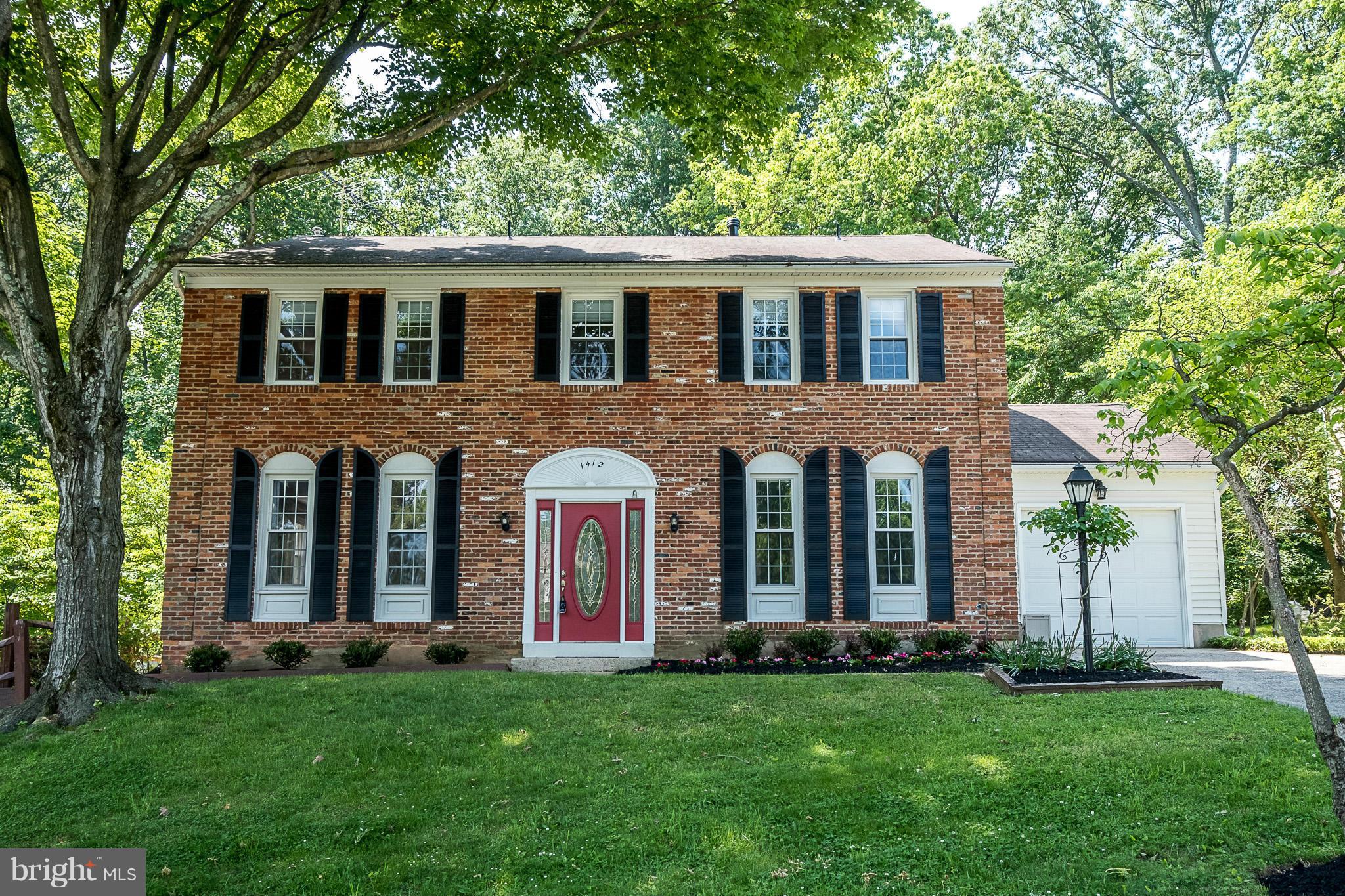 1412 Winding Waye Lane Silver Spring, MD 20902 - Photo 1 of 30 front view of the house and a yard