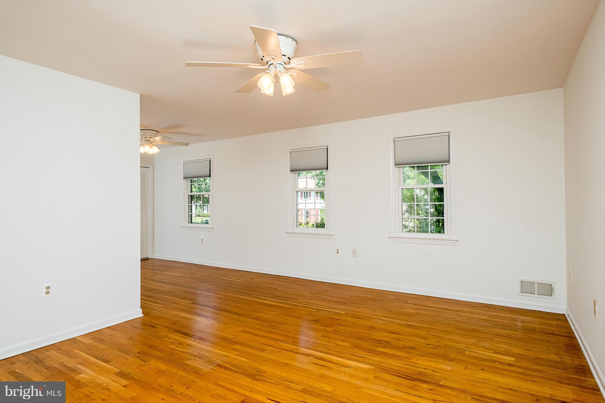 1412 Winding Waye Lane Silver Spring, MD 20902 - Photo 11 of 30 wooden floor in an empty room with a window