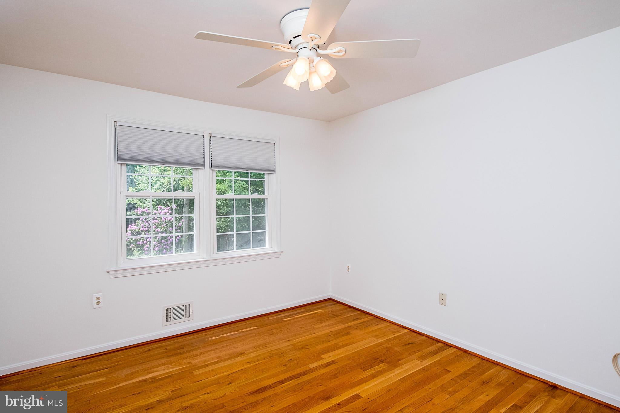 1412 Winding Waye Lane Silver Spring, MD 20902 - Photo 17 of 30 an empty room with a window and a fan