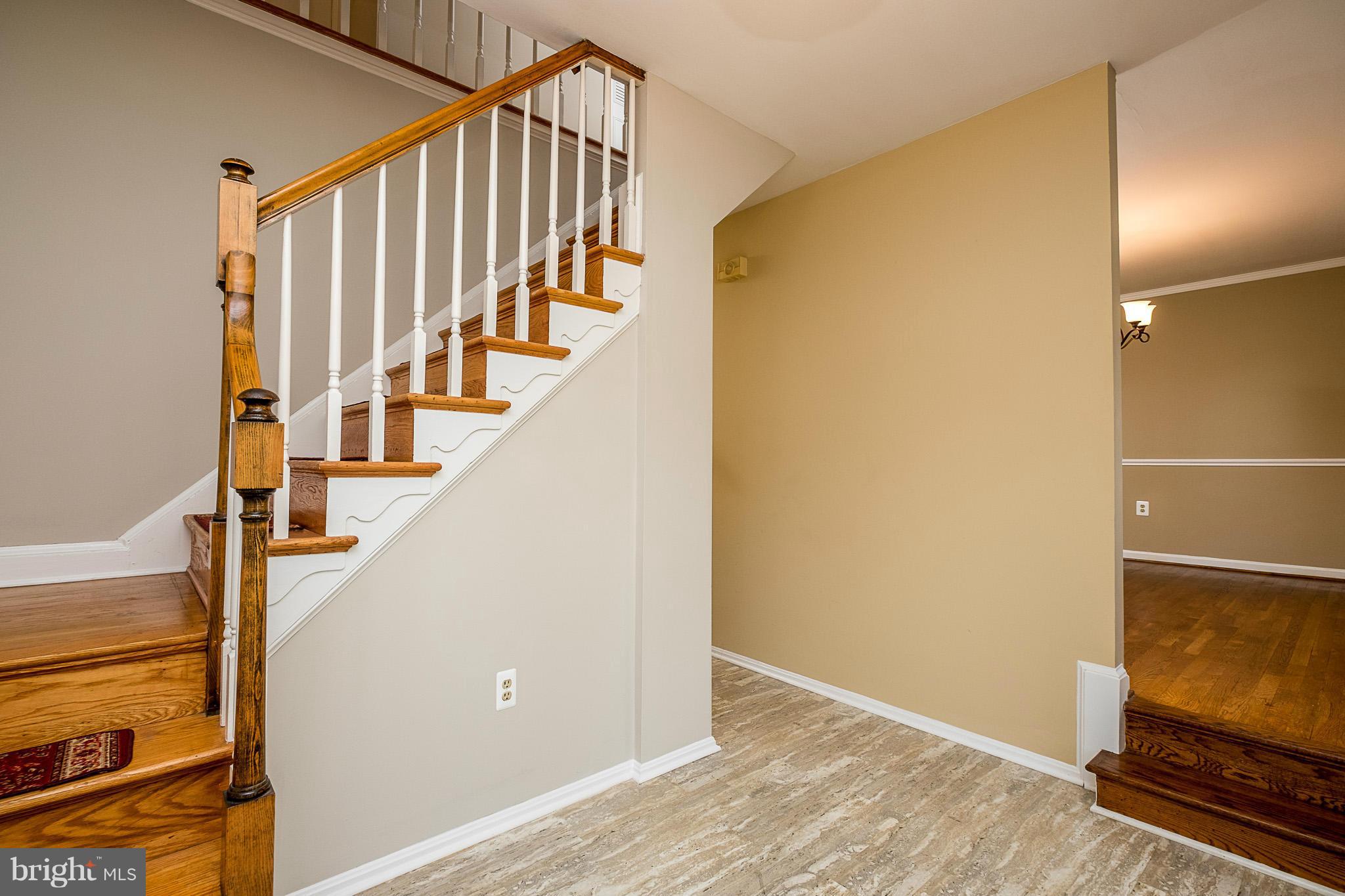 1412 Winding Waye Lane Silver Spring, MD 20902 - Photo 3 of 30 a view of entryway with wooden floor and stairs